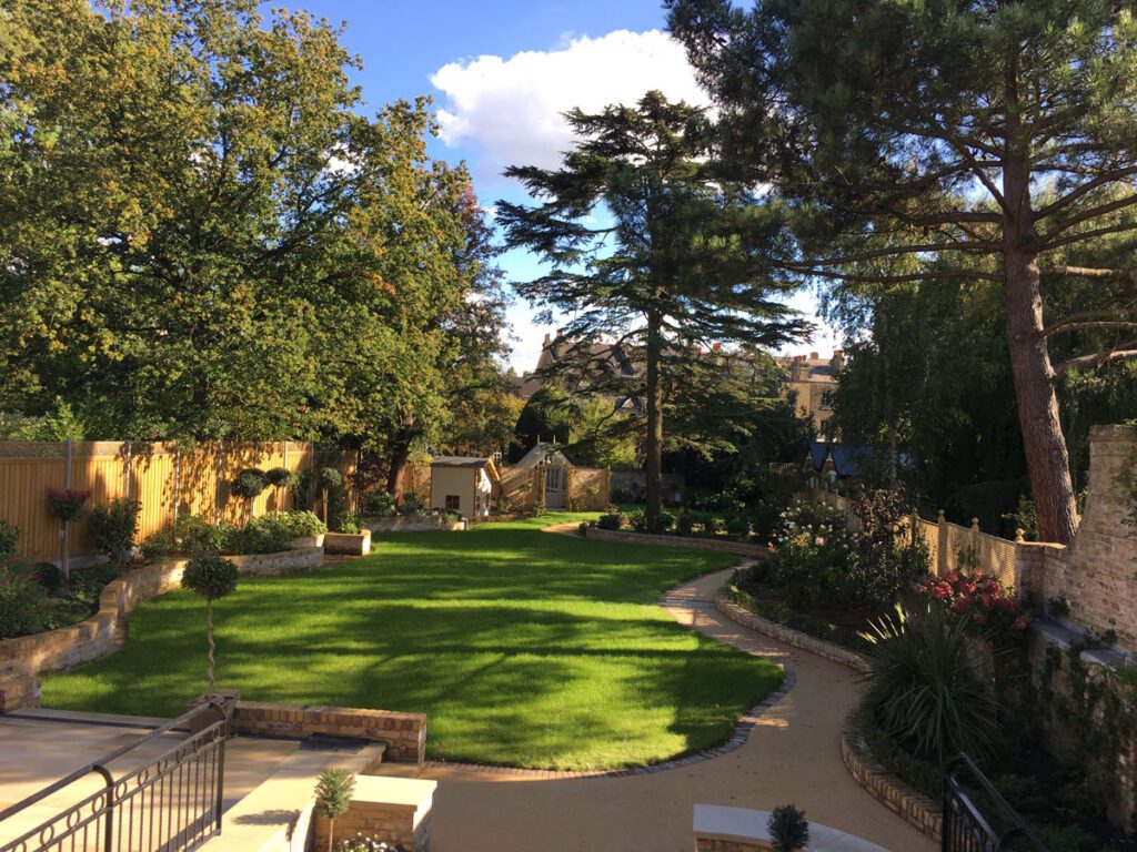 Stunning large english garden design with curved pathways and beautiful trees