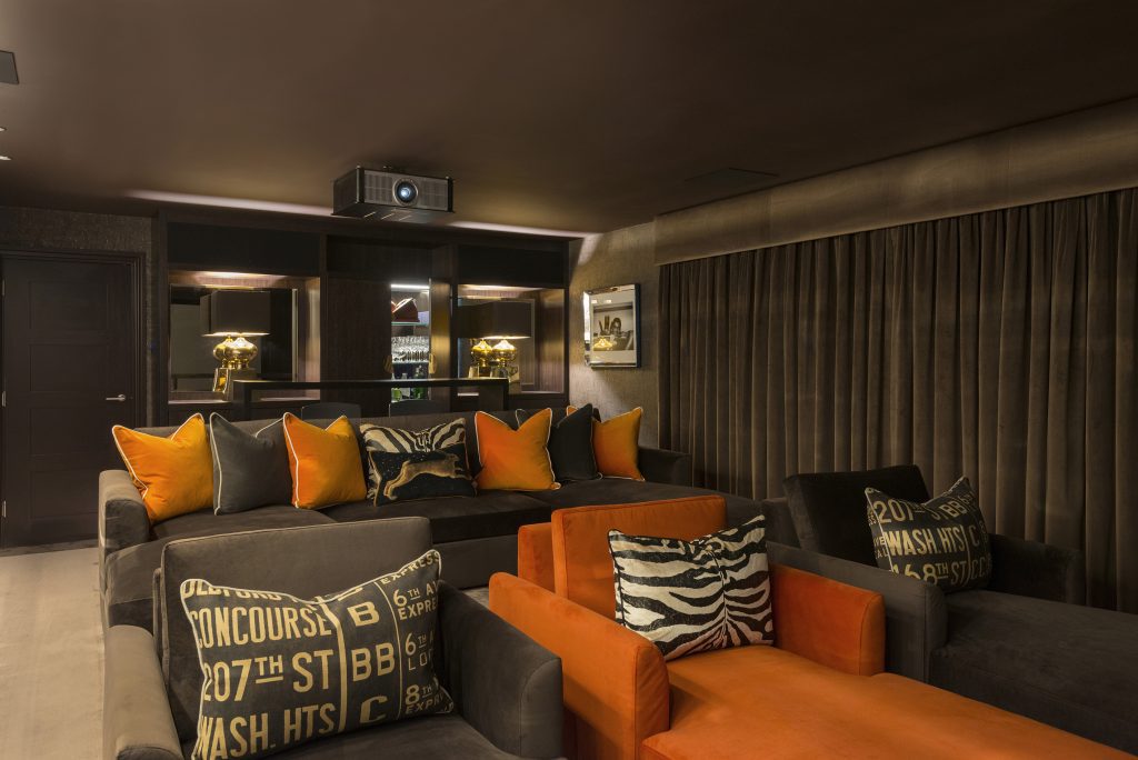 Glamorous home cinema room with cocktail bar bespoke joinery