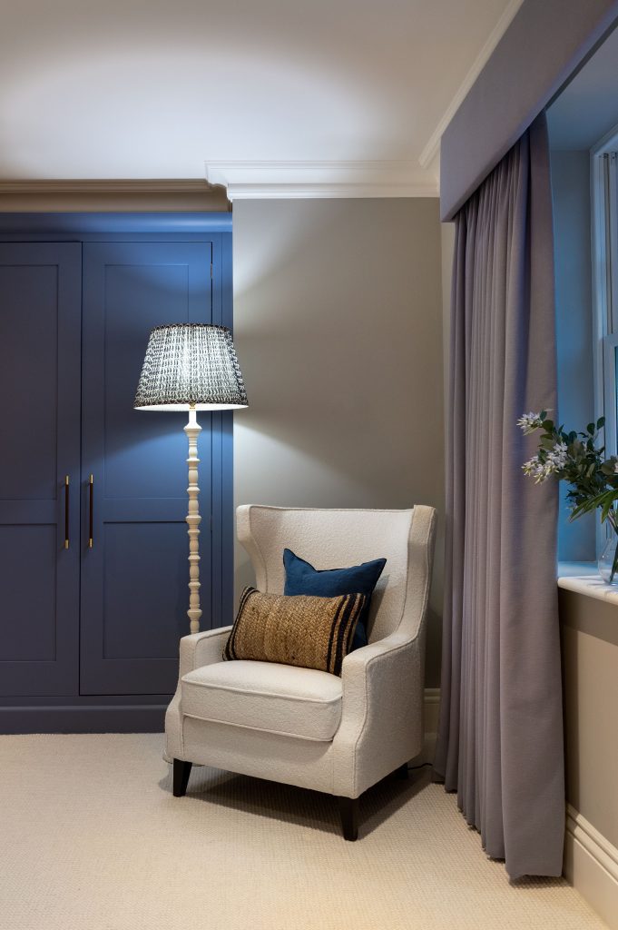 The depth of the lupin colours of the room are complimented by the home luxury decor of the creames and soft blues