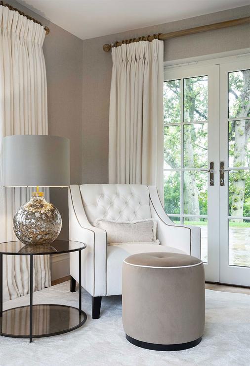 Stunning living room interior reading corner with bespoke furniture and luxury lighting.