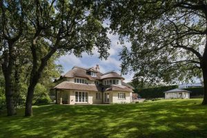 Landscaped Gardens and Thatched Roof Property